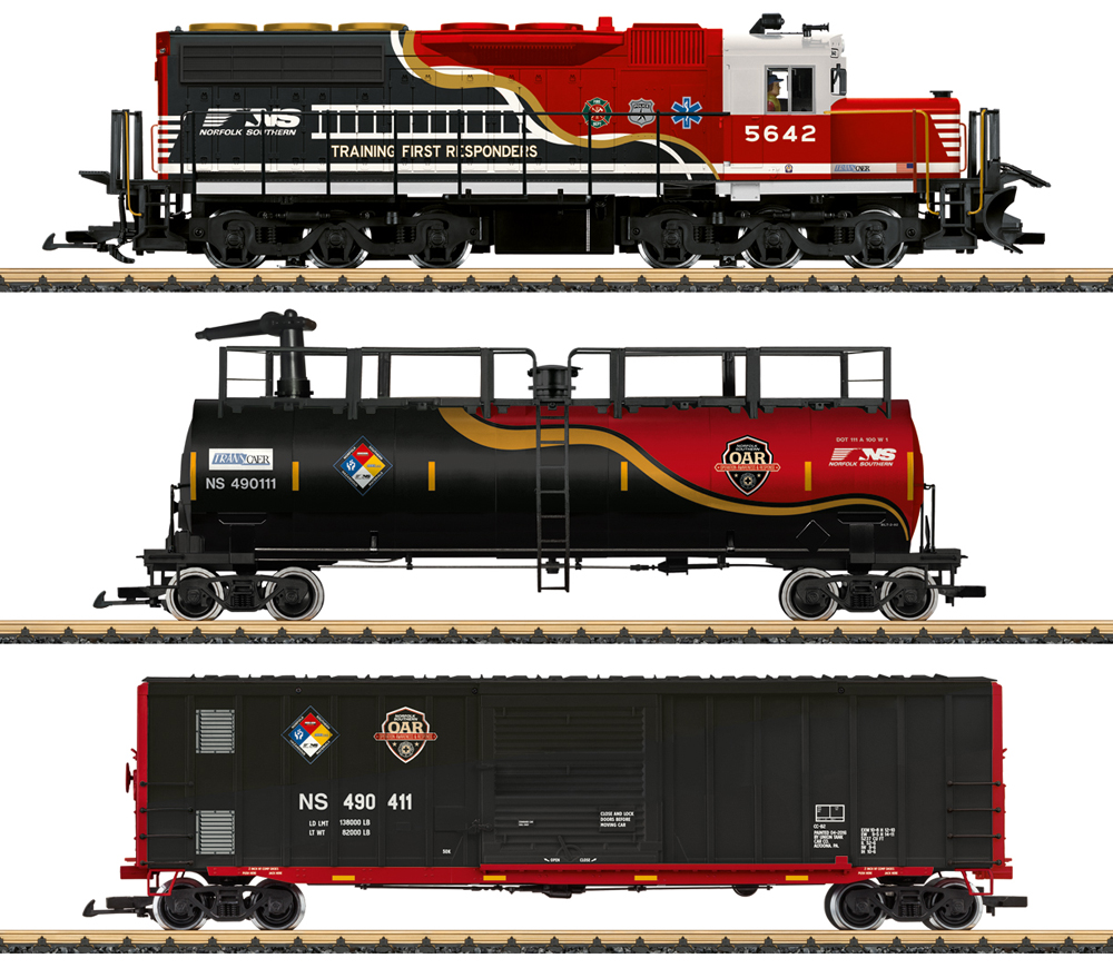 Photo of large scale locomotive, tank car, and boxcar painted red, white, yellow, and black with various safety and first responder graphics.
