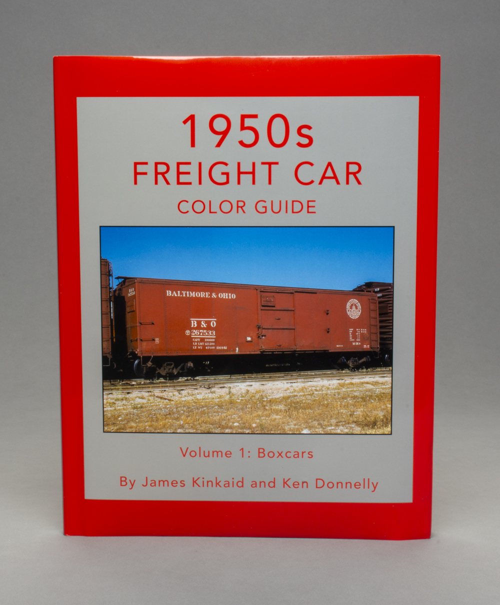 Photo showing red and gray book cover with color photo of oxide red 40-foot boxcar in middle.