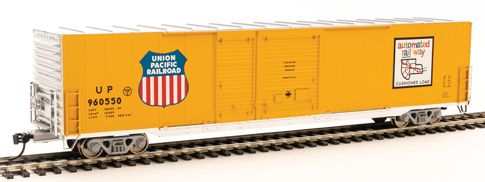 Photo of HO scale double-door boxcar painted yellow and silver with red, white, and blue graphics on white background.