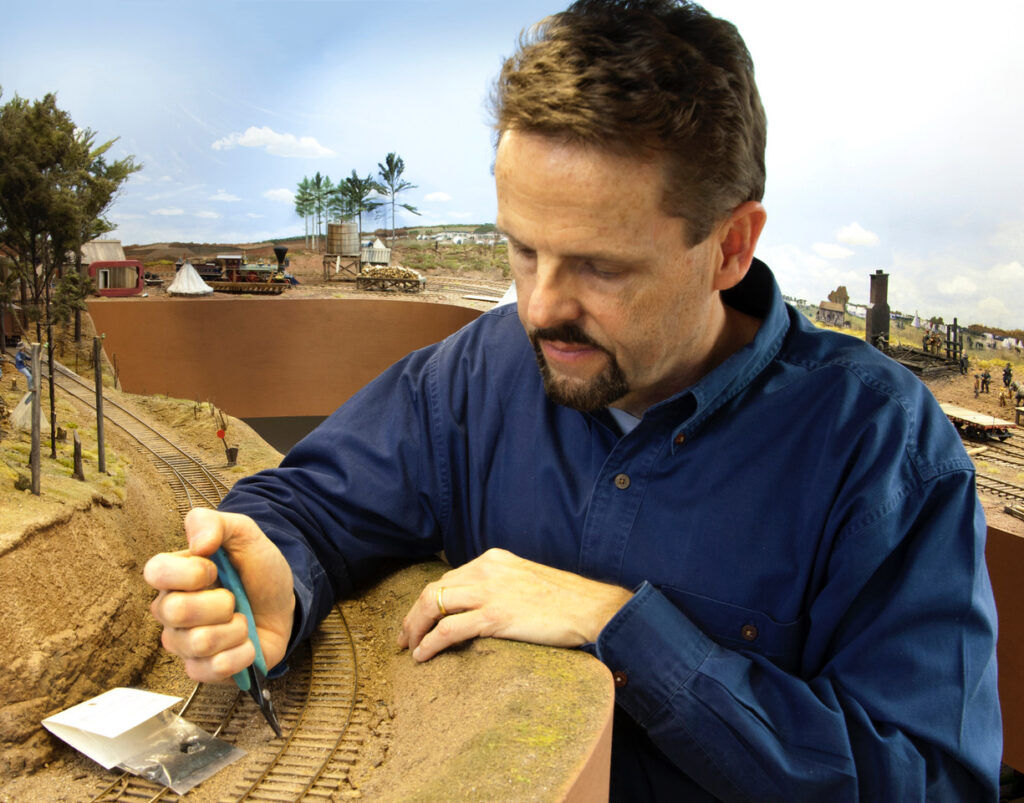 Man working on model layout