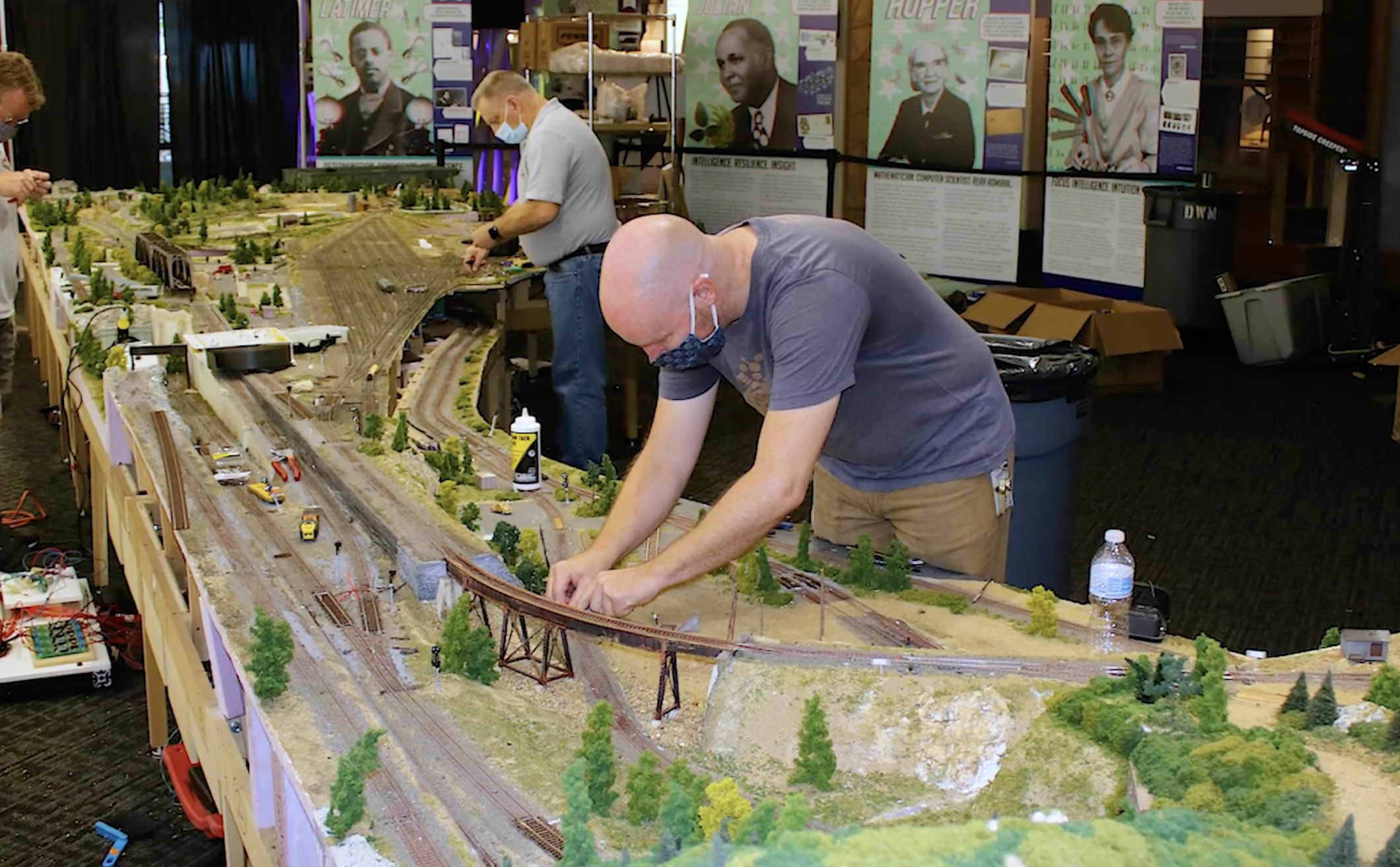 People working on putting the layout at Discovery World together. 