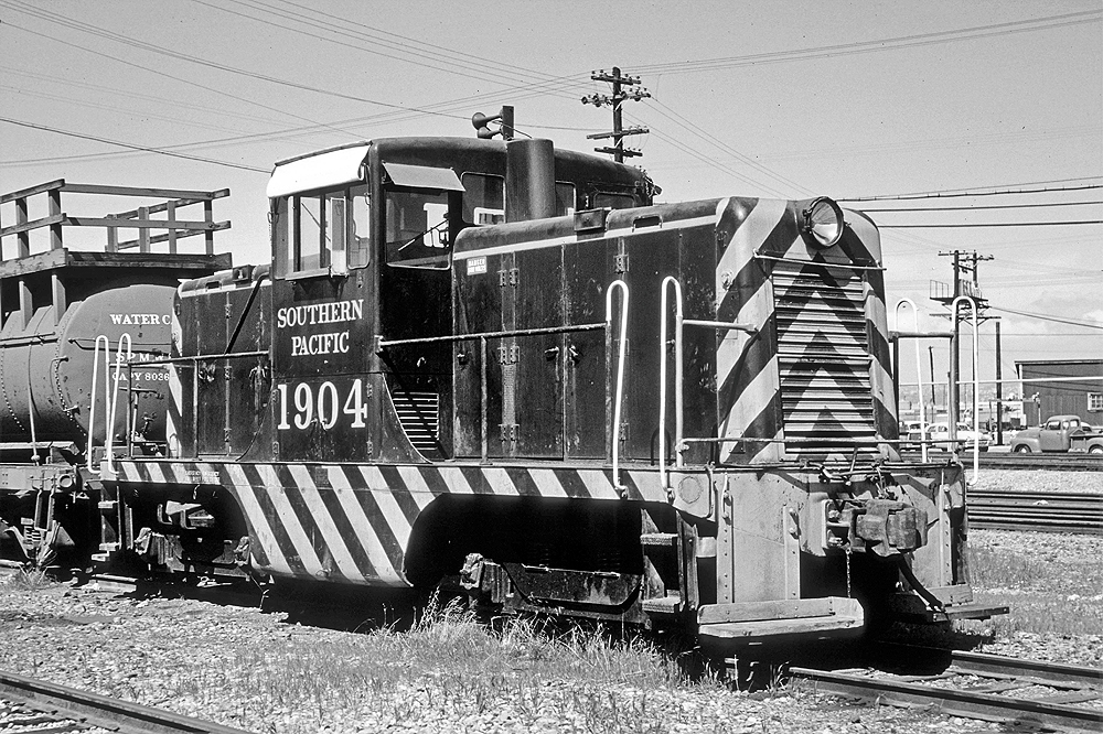 Stripped center cab locomotive with large side numbers.