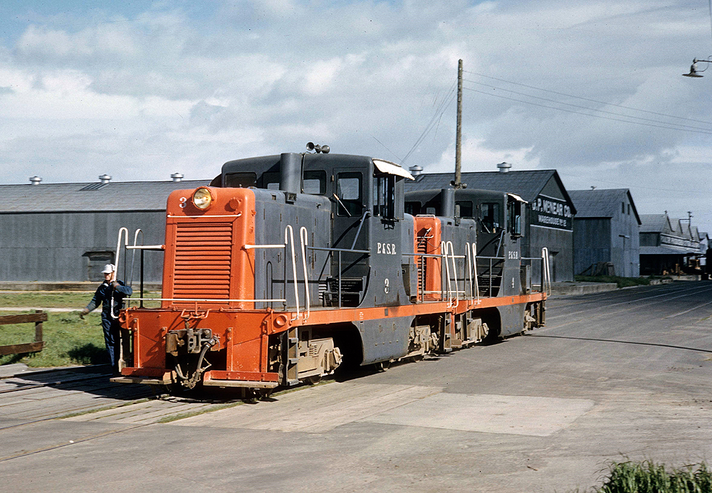 Grey and orange locomotives.