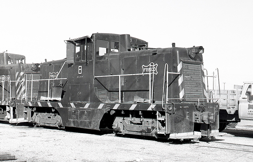 Black and white image of center cab locomotives.