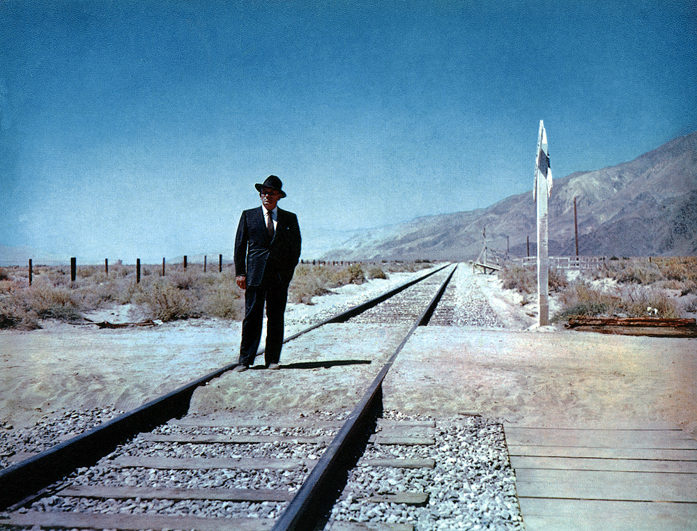 Bad Day at Black Rock filming location: Man in dark colored suit stands on a railroad track in the desert.
