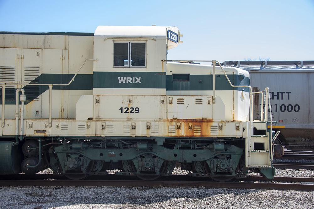 Side view of locomotive showing sloping short hood