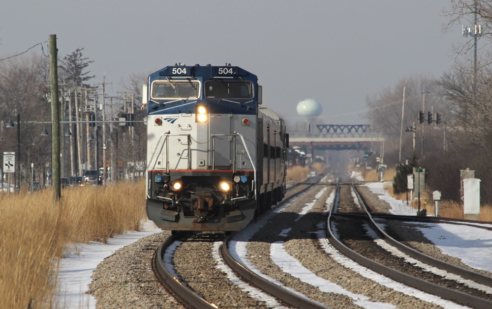 Head-on view of passenger train with road-switcher-stye locomotive