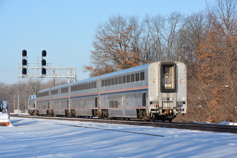 Going-away view of four-car passenger train