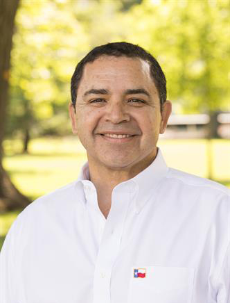 Head shot of man outdoors wearing white shirt