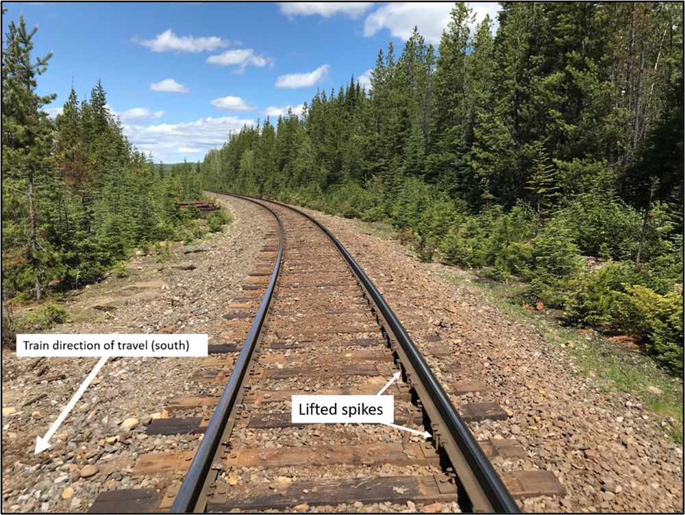 Photo of track with notations on derailment details