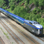 Passenger train with stainless steel dome-observation car