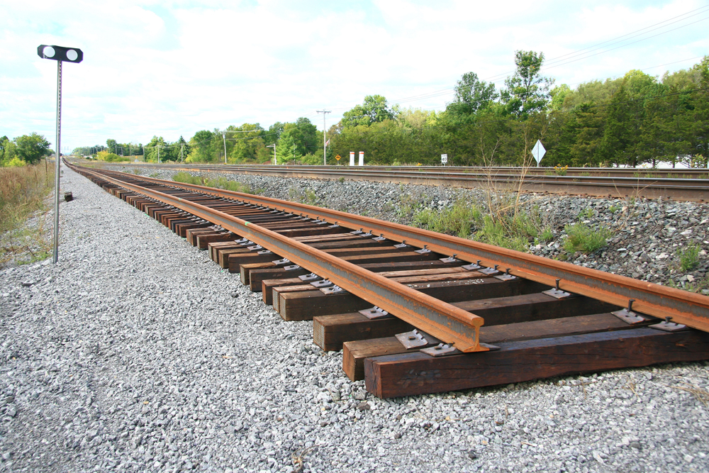 Track under construction next to existing rail lines