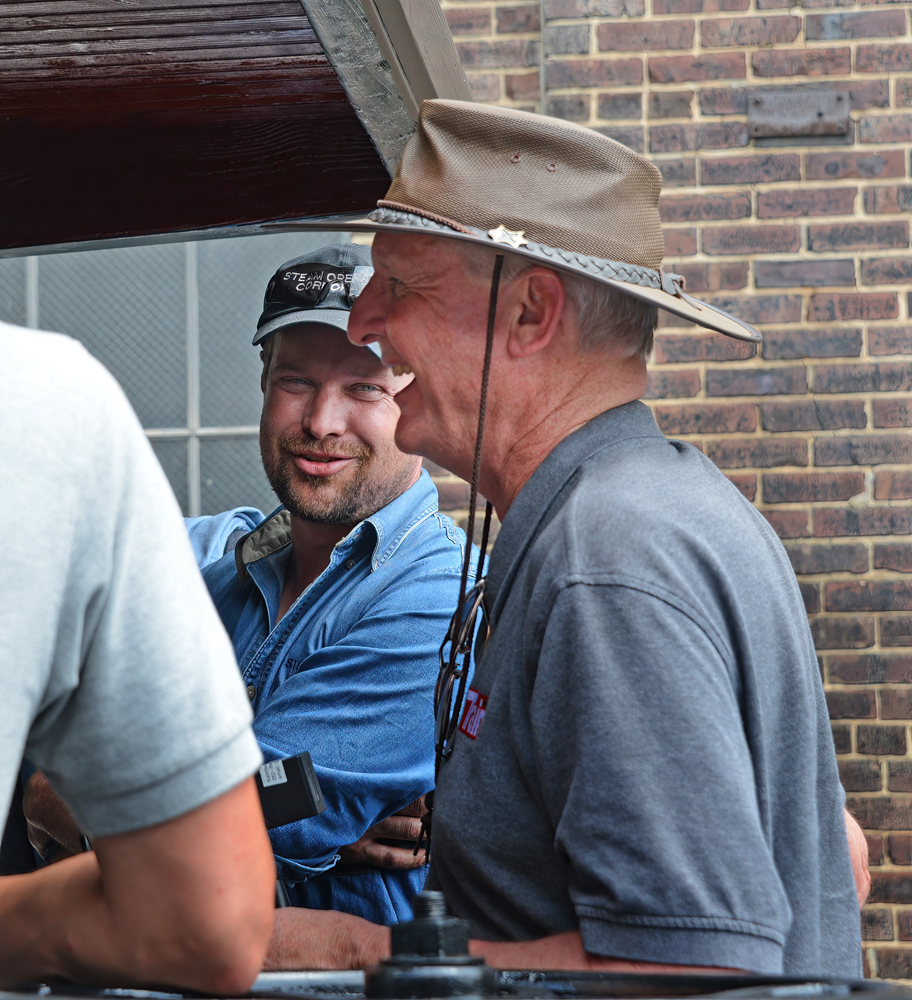 Man laughing with other people