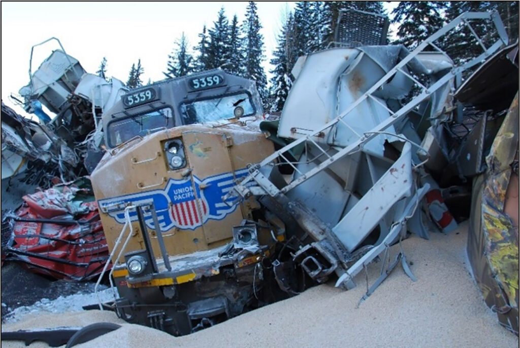 Locomotive surrounded by cars from derailment
