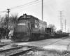 Diesel locomotive with alternating gondola and tank cars