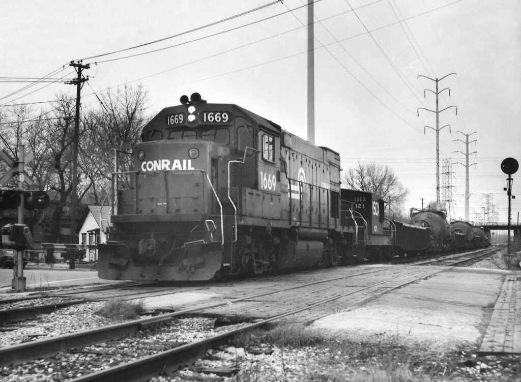 Diesel locomotive with alternating gondola and tank cars