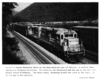 Conrail freight trains bending around horseshoe curve