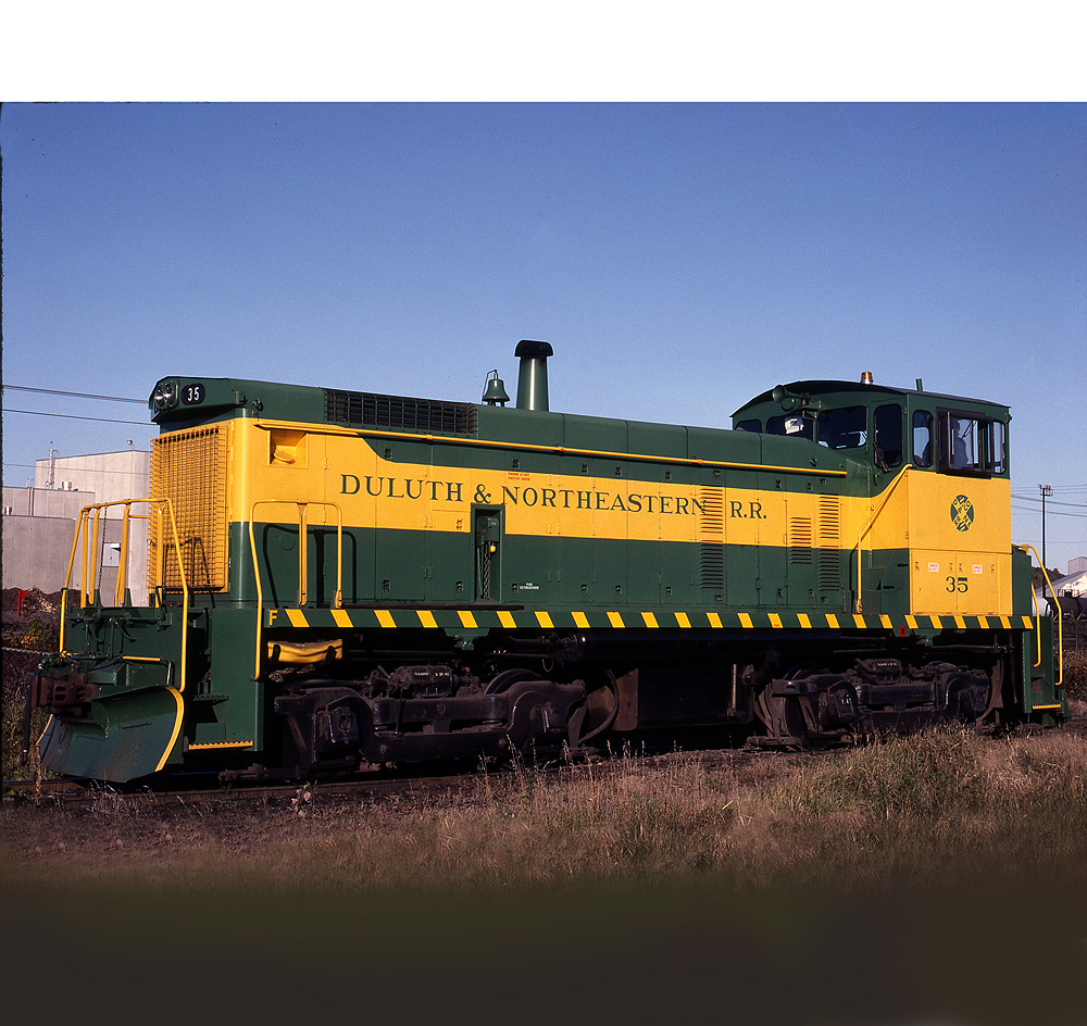 Clean looking green-and-yellow painted locomotive.