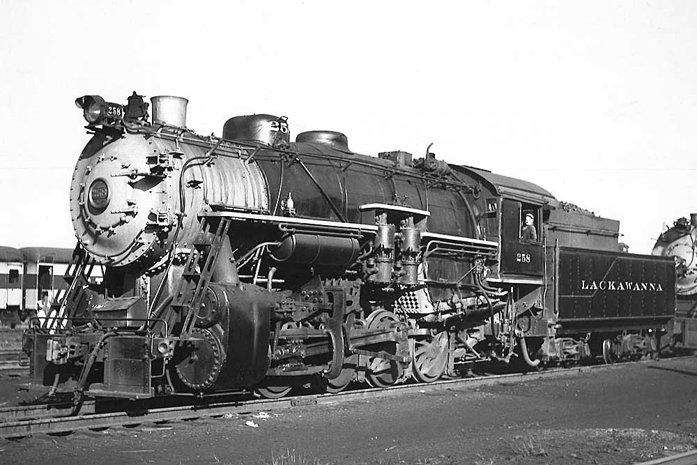 Steam locomotive in a rail yard.