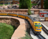 Diesel locomotive approaches on garden railway
