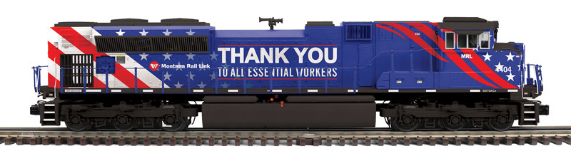 Photo of O scale locomotive painted red, white, blue, and black with white graphics.