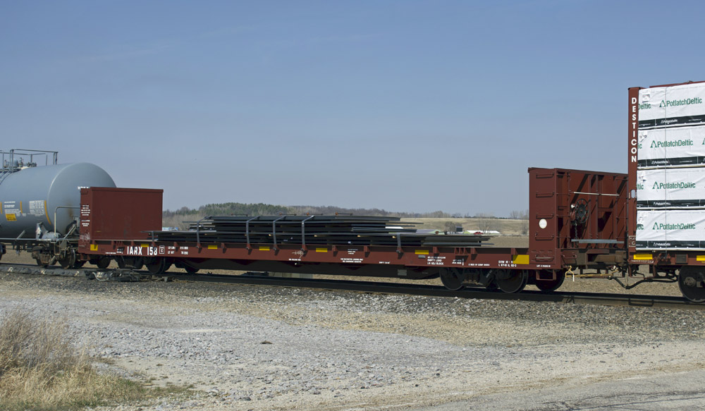 Modeling freight car loads: Photo of Oxide Red flatcar with steel plate load.