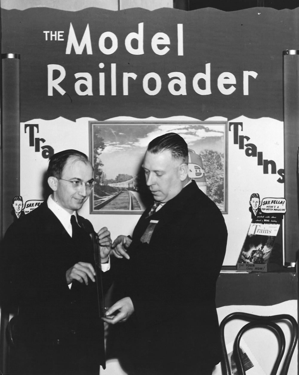 Two men discussing trains