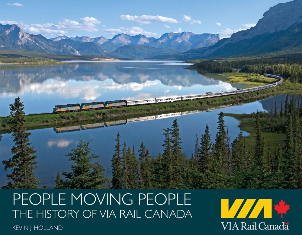 Cover image of book with passenger train passing through mountain scene with trees and lake.