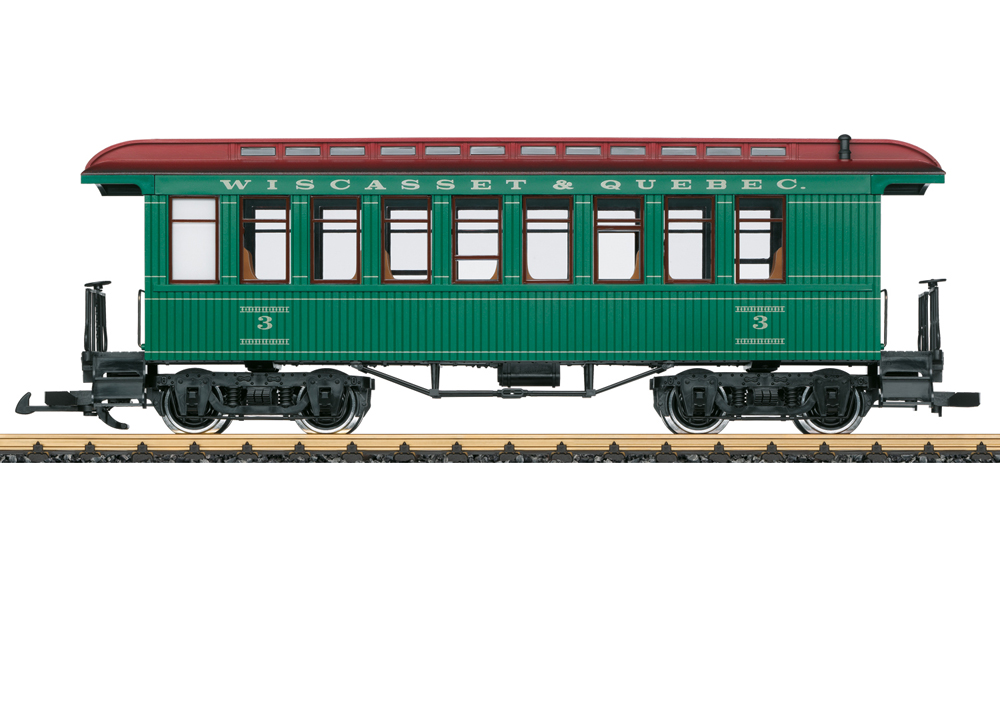 Photo of double-sheathed passenger car painted green and red.