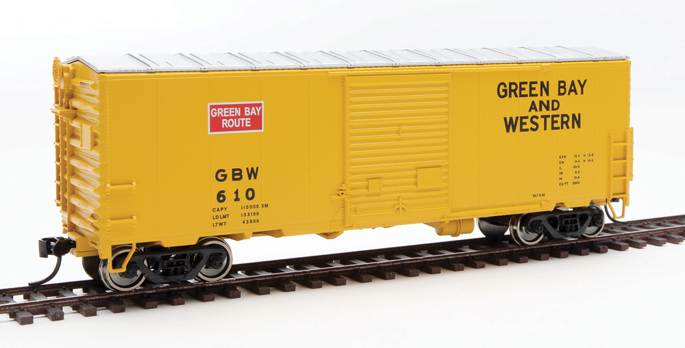 HO scale boxcar painted yellow and silver with red and black graphics.
