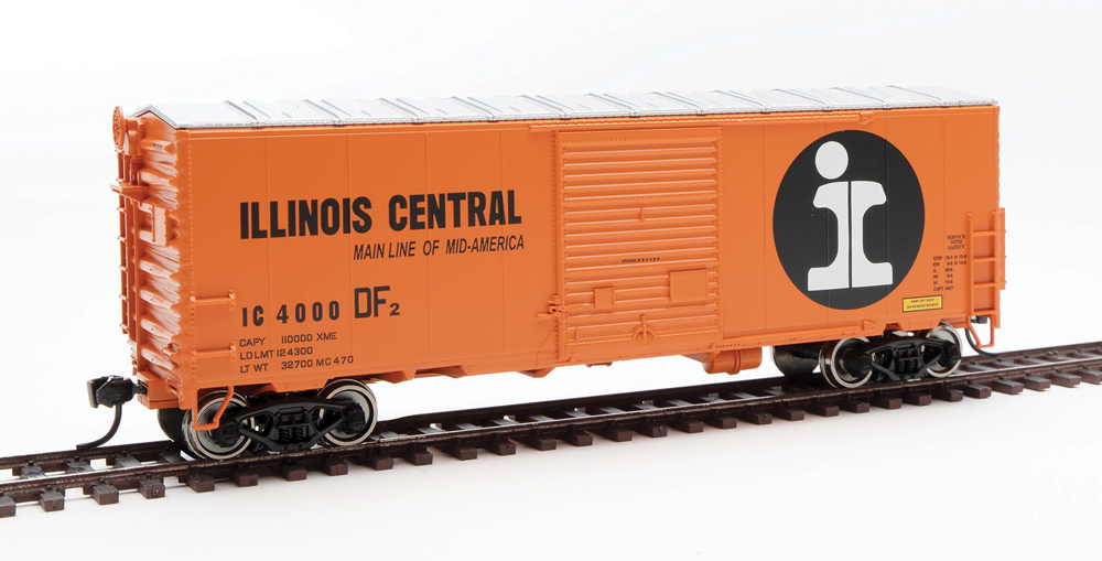 HO scale boxcar painted orange and silver with black and white graphics.