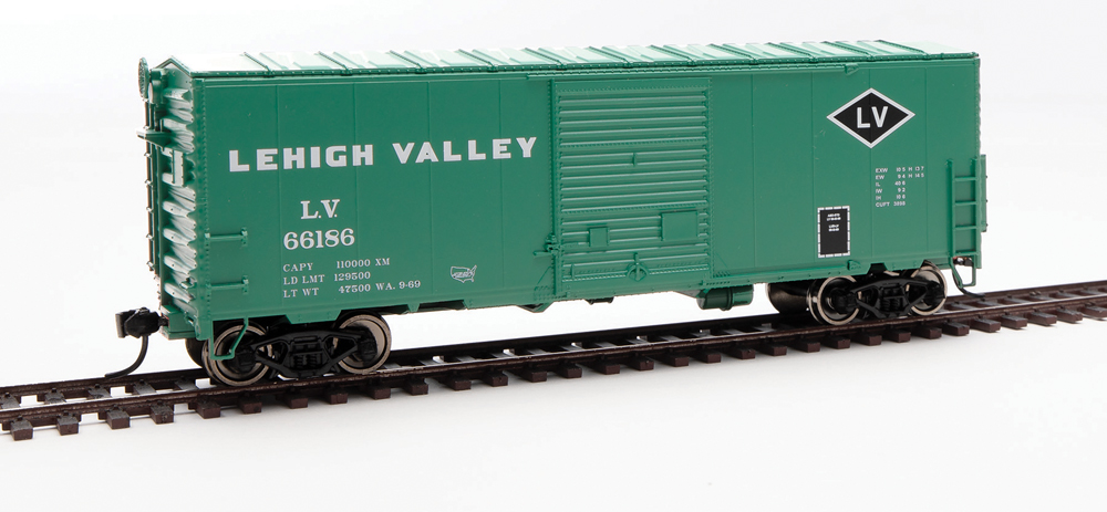 HO scale boxcar painted United States Railroad Equipment Green with black and white graphics.