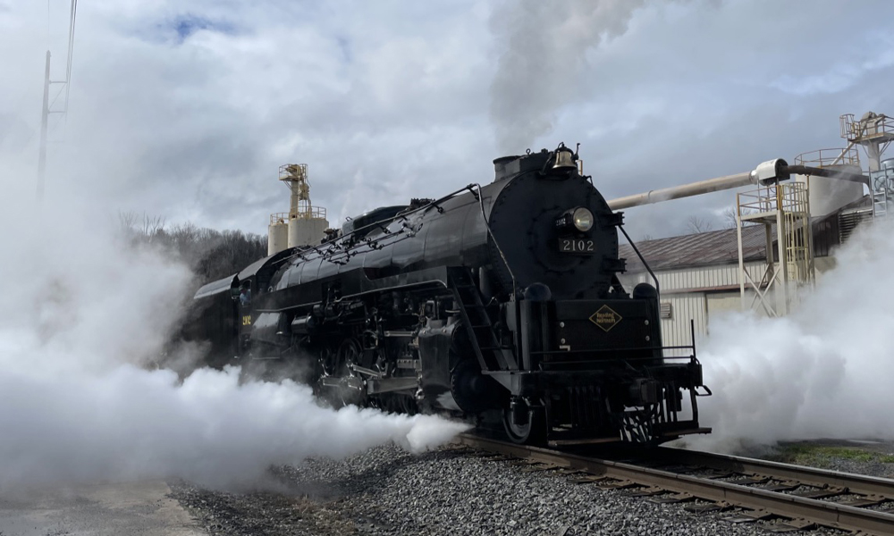 Steam locomotive blowing out steam