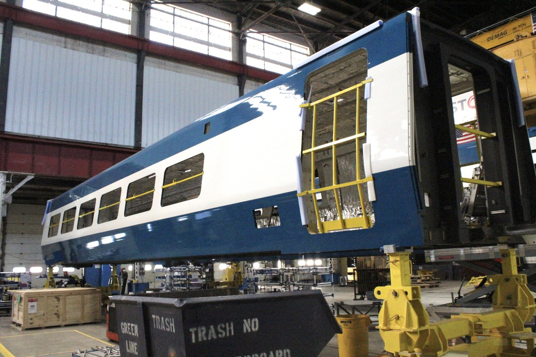 Blue and white car for high speed train under construction