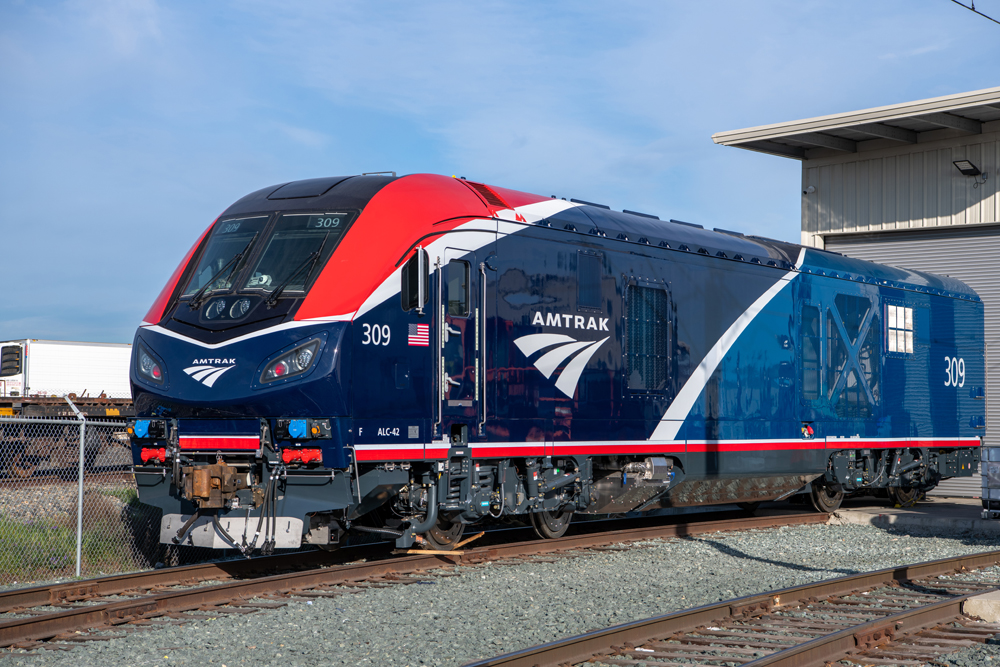 Locomotive with red, dark blue, and medium blue paint scheme