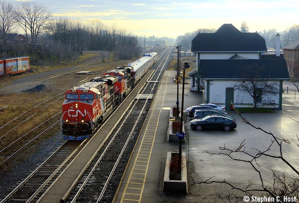 Passenger train passes station