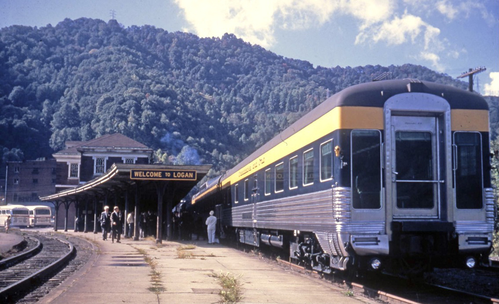 Streamlined office car at back of passenger train