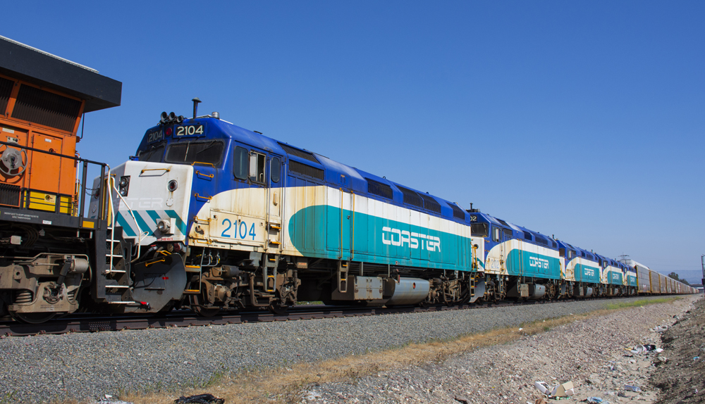 Five passenger locomotives at front of freight train