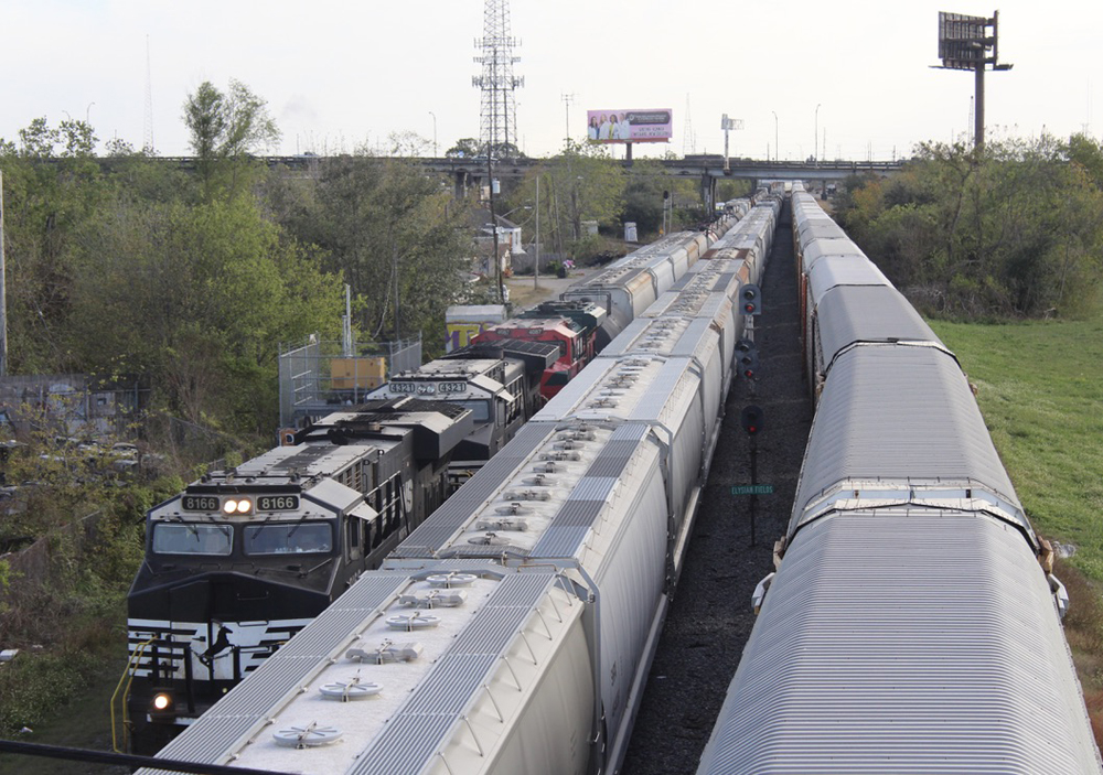 Trains on three tracks as seen from bridge