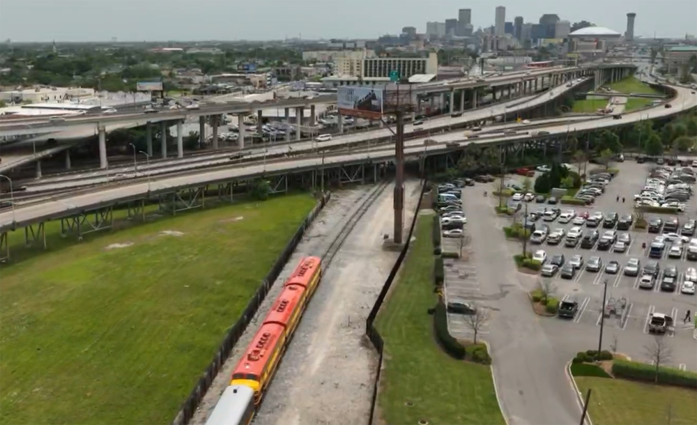 Aereal view of passenger train approaching city