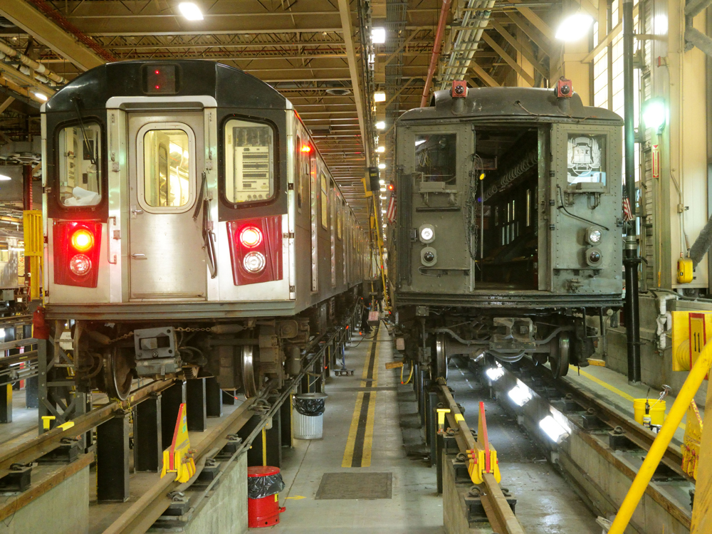 Vintage subway equipment next to modern car