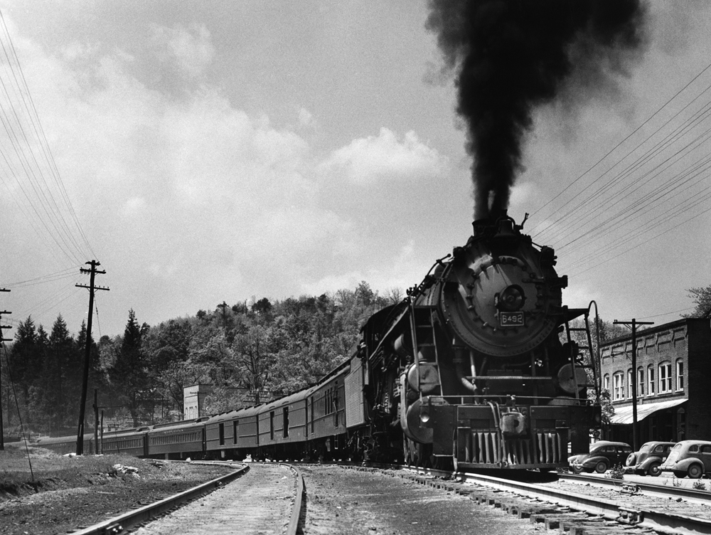 Steam locomotive with thick smoke plume charging upgrade.