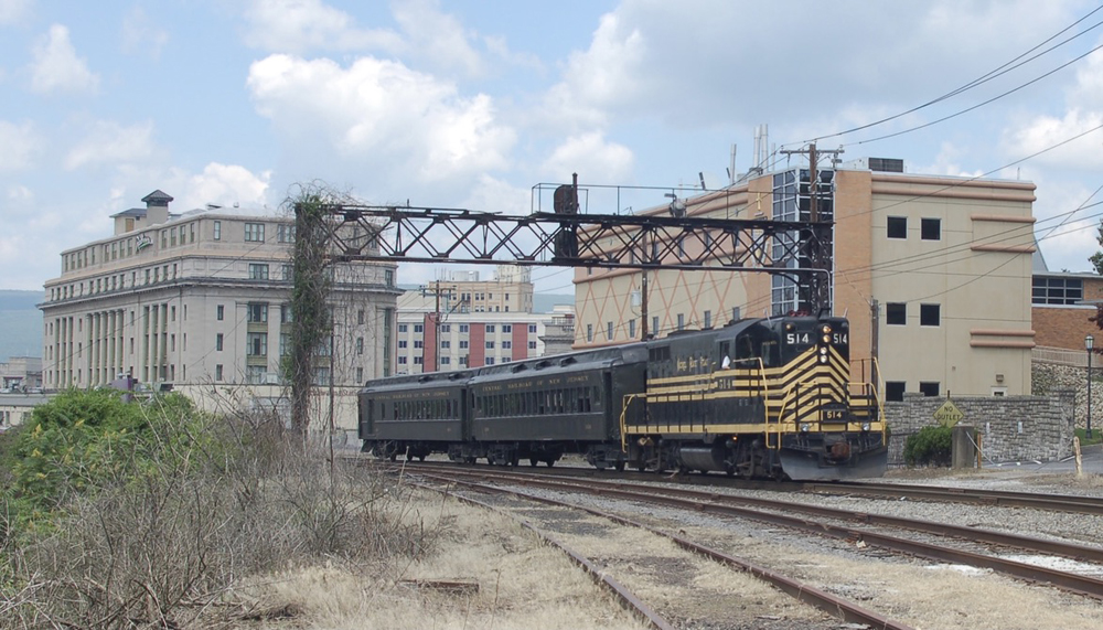 Excursion train of locomotive and two passenger cars