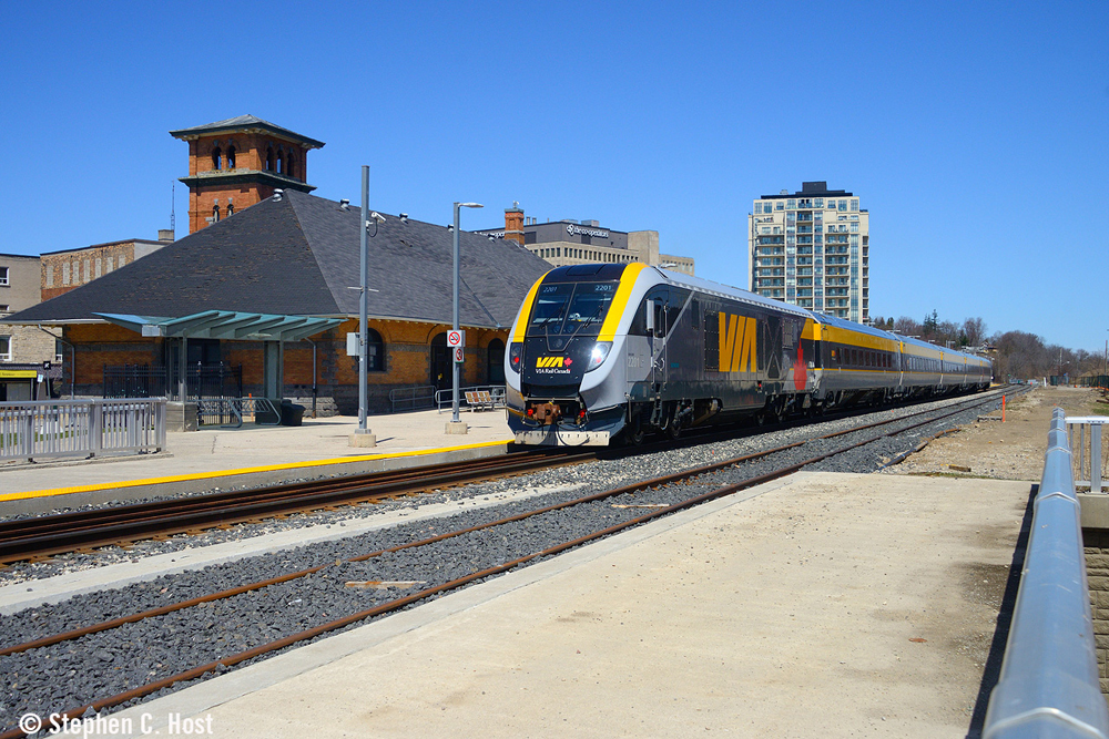 Passenger train passing station