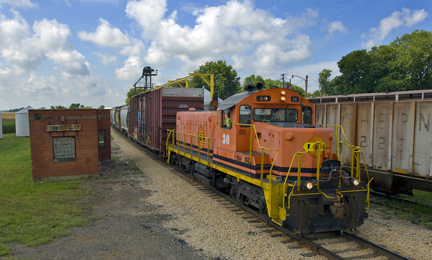 Orange locomotive on train