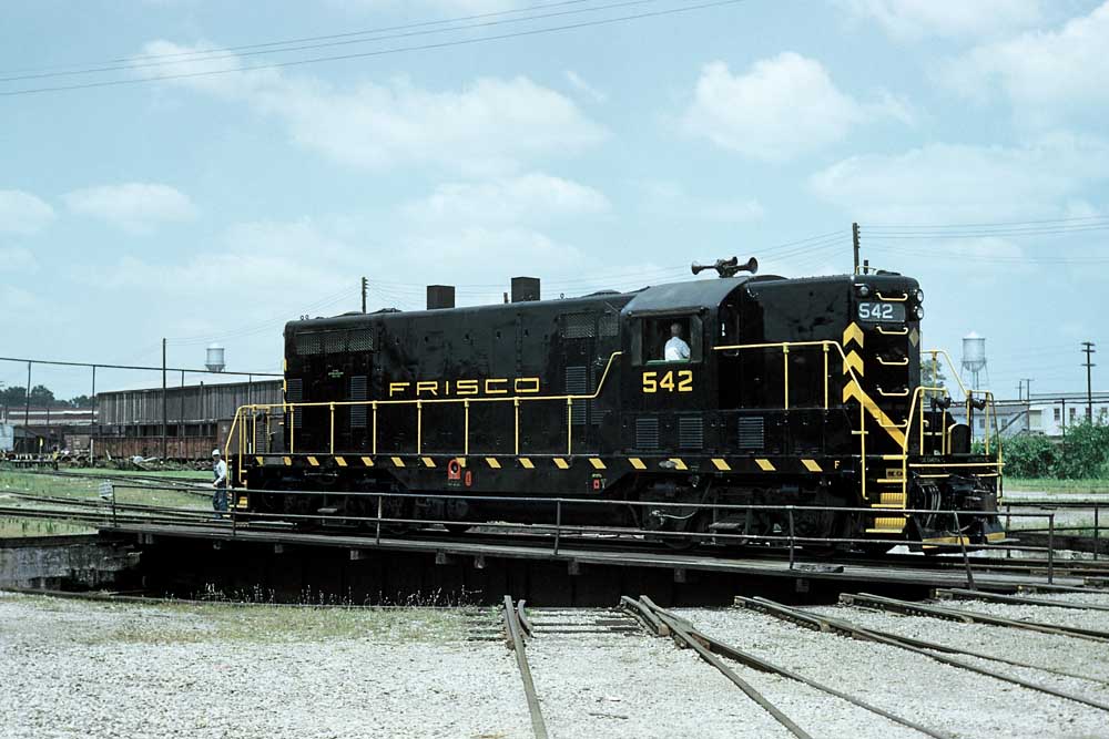 Black and yellow diesel locomotive on turntable