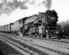 Steam locomotive hauling a freight train.