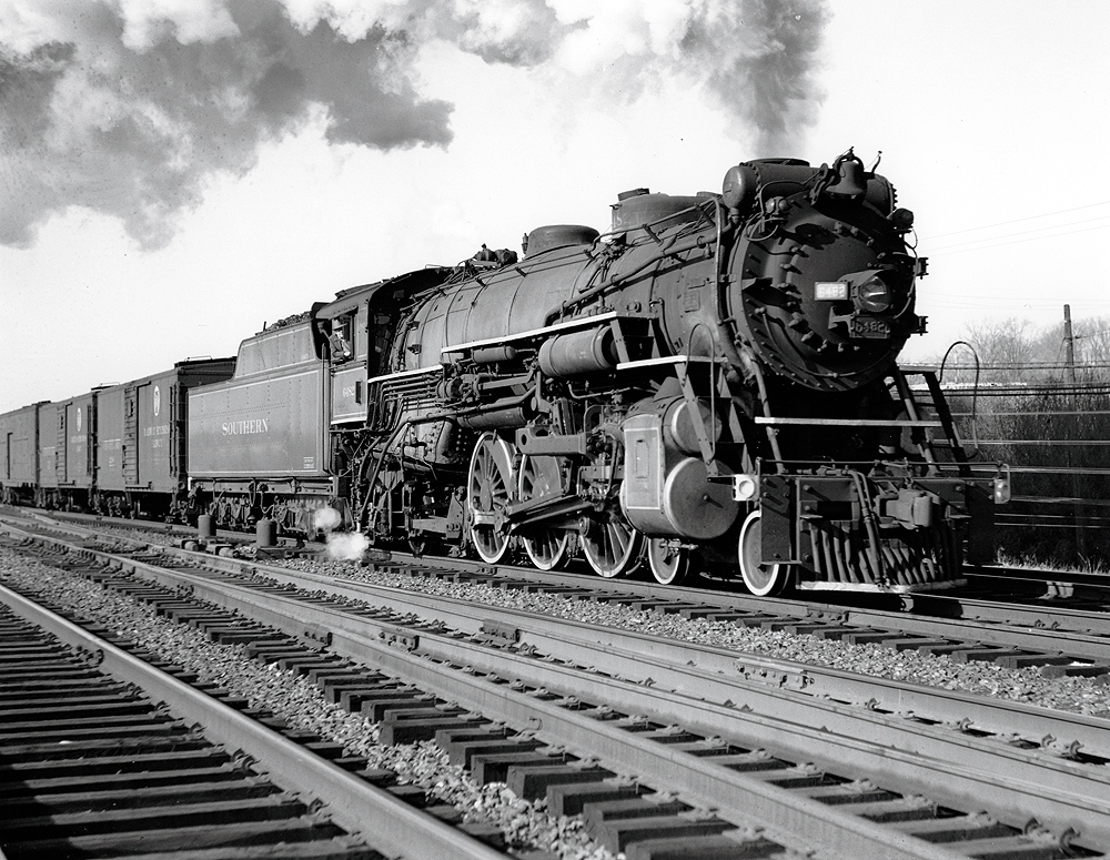 Steam locomotive hauling a freight train.