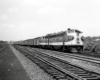 Streamlined locomotives leading a passenger train.