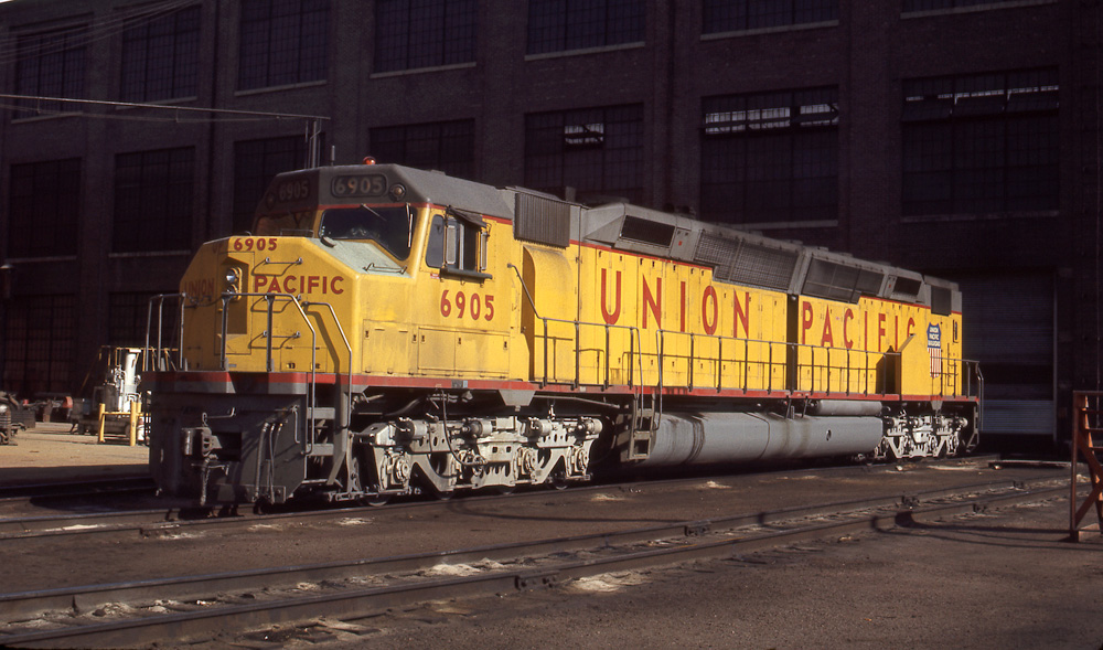 Yellow and gray EMD DDA40X diesel locomotive